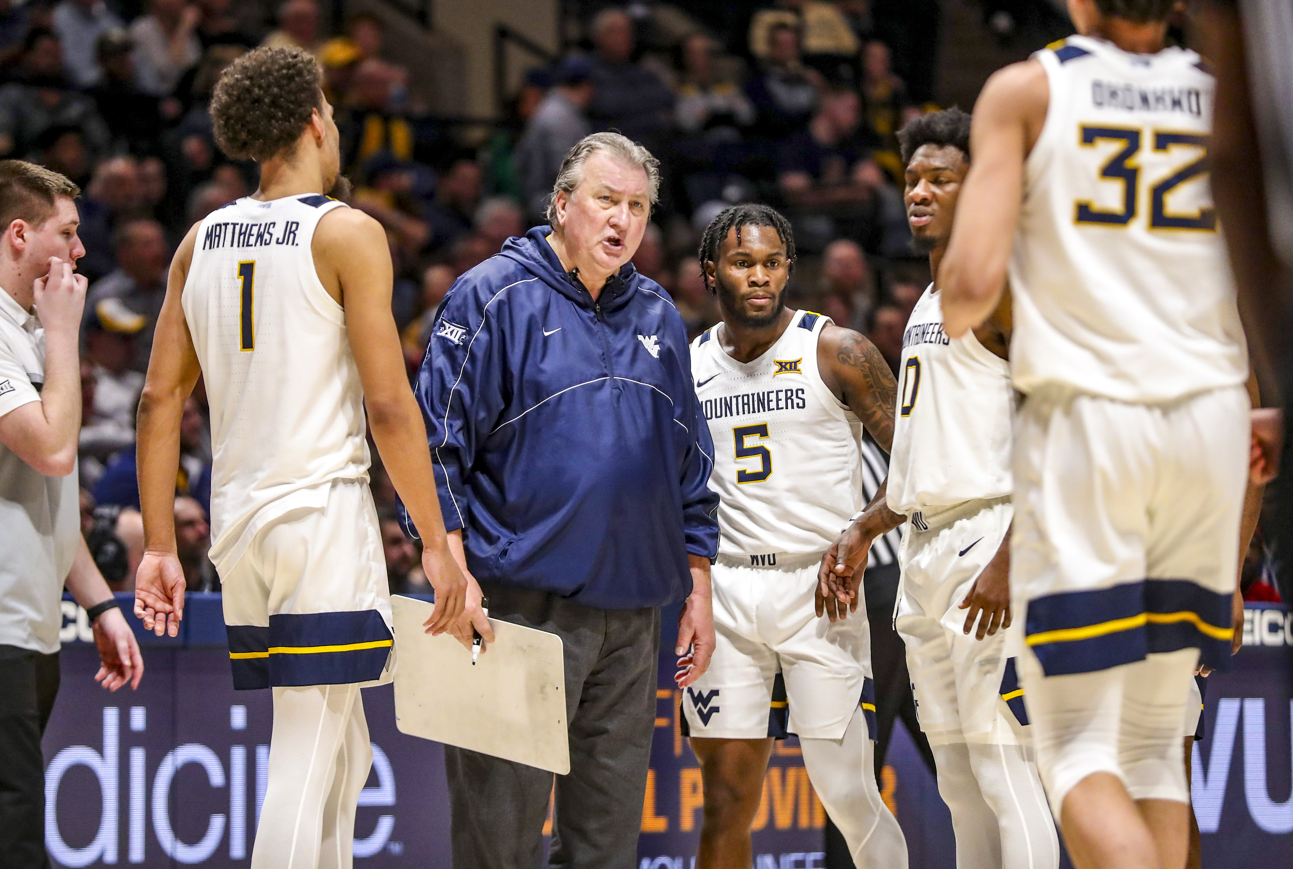 WVA coach Bob Huggins talks to his team during a timeout.